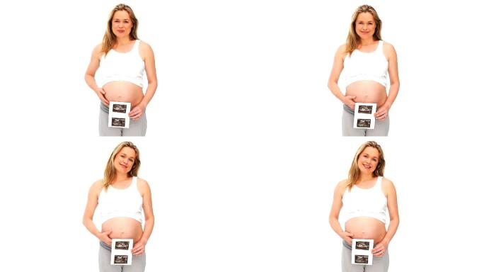漂亮的孕妇与她的未来宝宝的扫描