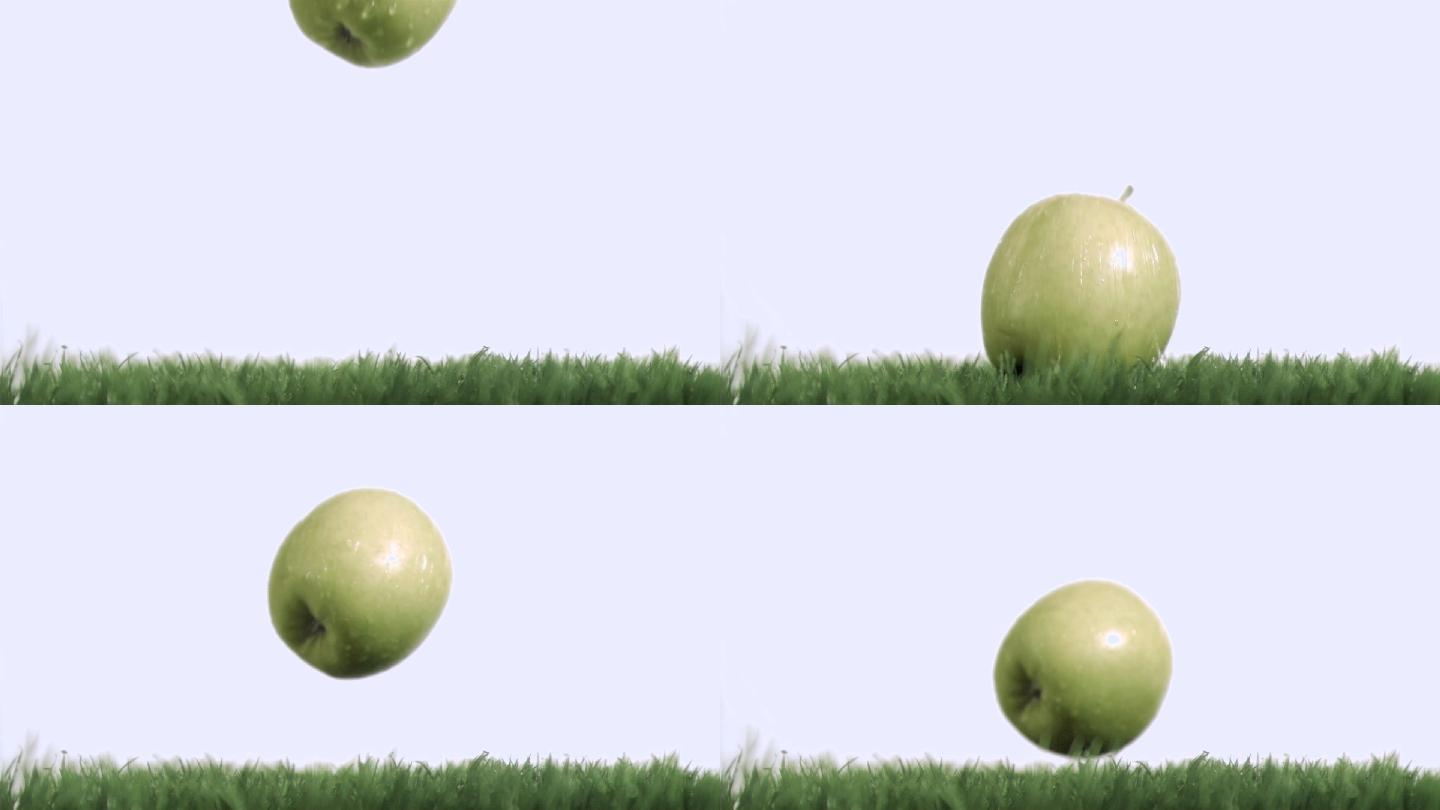 青苹果落在草地上慢镜头