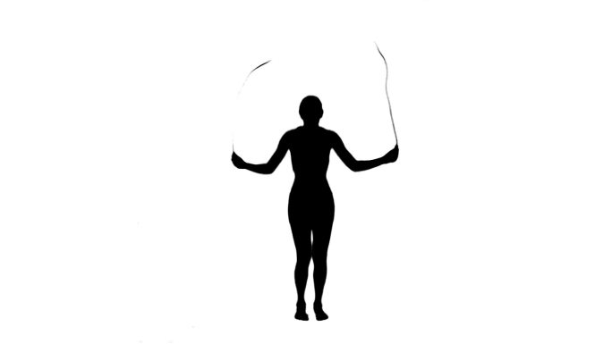 一个活跃女性的剪影正在用跳绳的白色背景