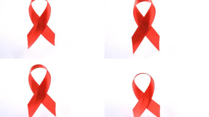 红色爱滋病意识丝带在慢动作下降