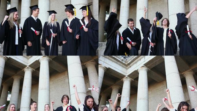 五个白人青年身着毕业礼服扔帽子实时拍摄