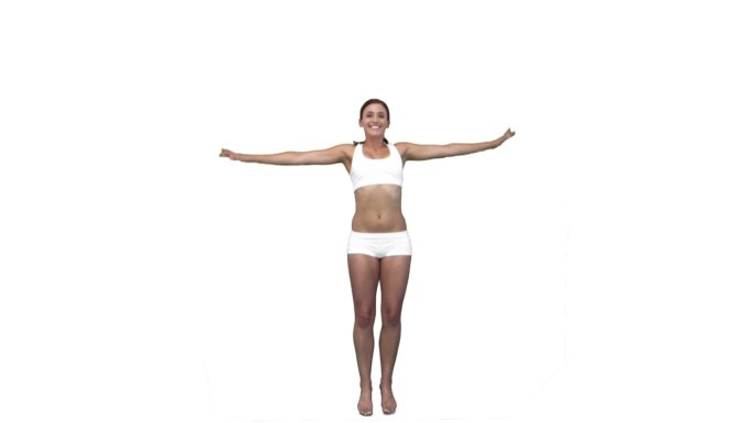 一个西方女子四肢伸展跳跃慢动作，在白色背景下