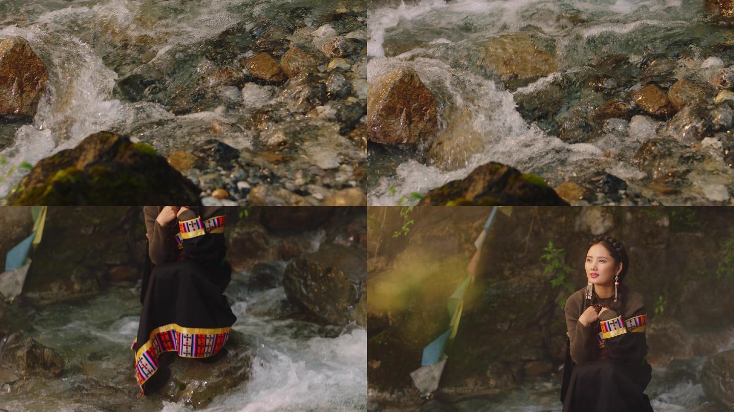 河水石头上的藏族女子