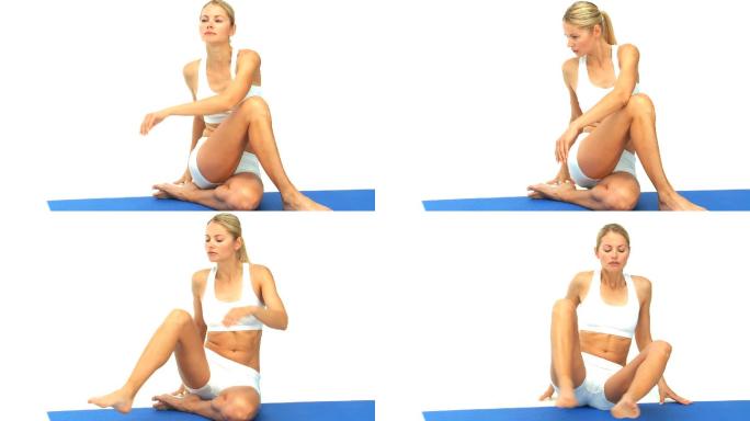 一个白人女性在瑜伽垫上做放松训练