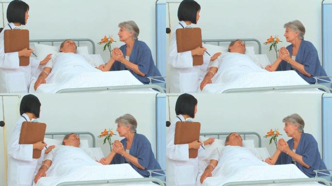 一个女人和她生病的丈夫在医院和护士谈话