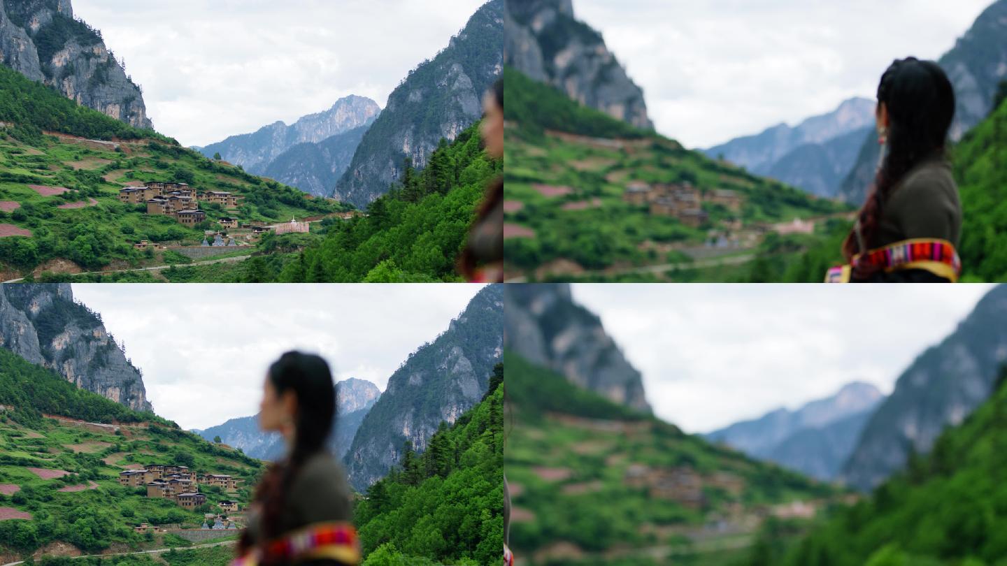 藏族女子凝望古村落