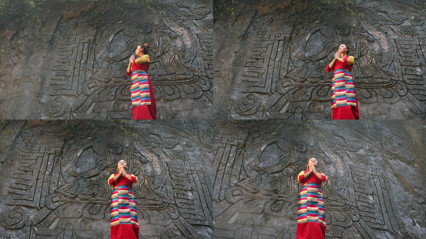 菩提树下佛教壁挂前的藏族女子祈愿