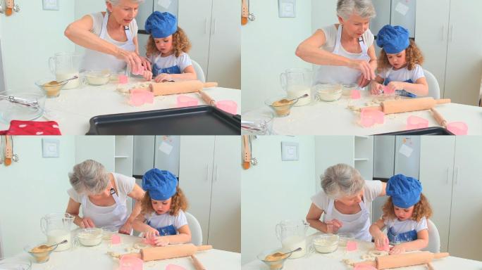奶奶和她的孙女在厨房烤饼干