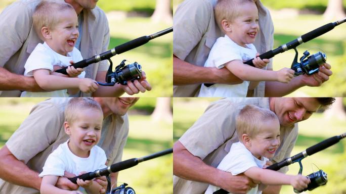 一个男人抱着他在公园钓鱼的小男孩