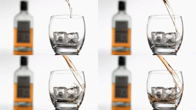 以超慢的动作将苏格兰威士忌倒入加冰的玻璃杯中