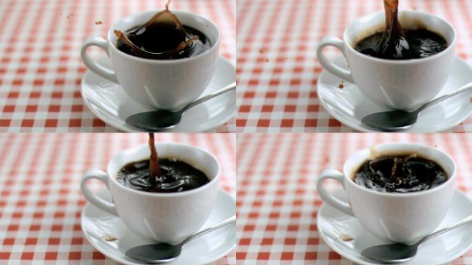 糖在超级慢镜头里被放在桌子上的一杯咖啡里