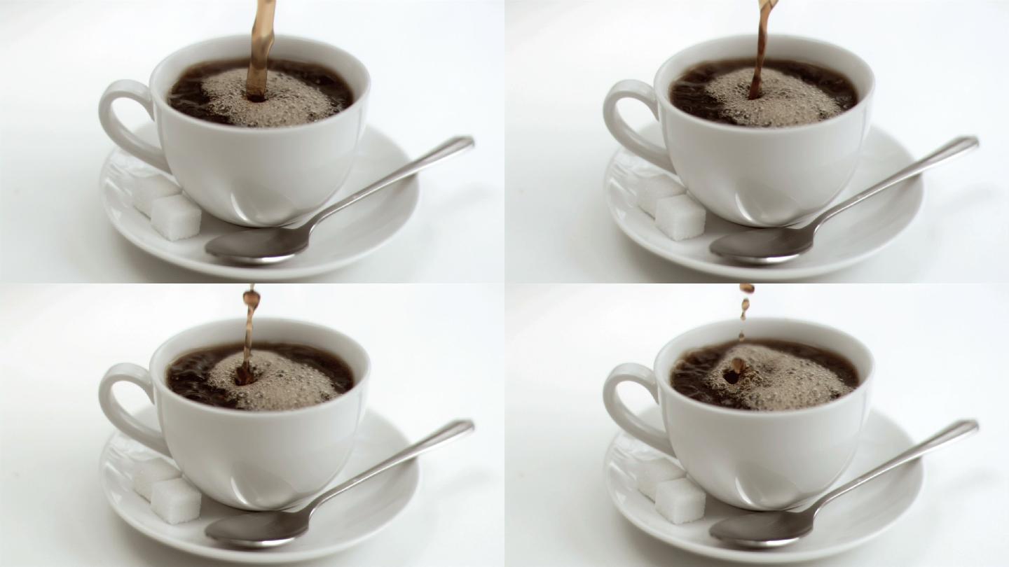 向咖啡杯里倒咖啡在白色背景下慢镜头