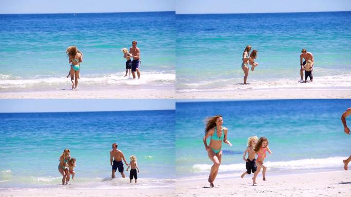 快乐的一家人在沙滩上玩耍