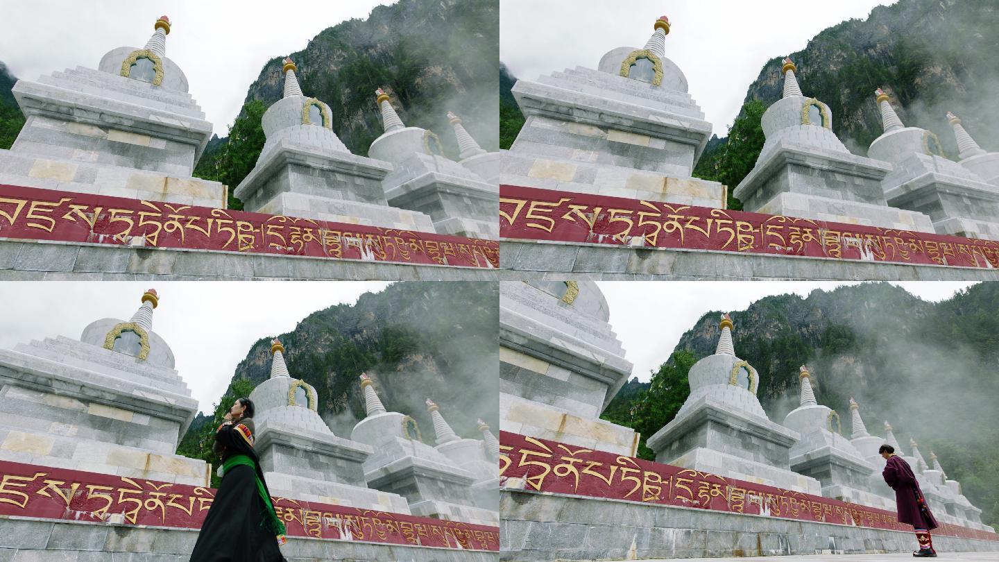 藏式佛塔白塔前男女祈愿