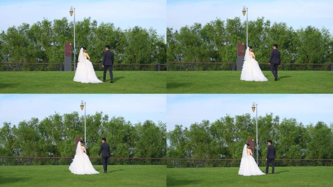 4K正版-实拍城市公园拍婚纱照的情侣夫妇