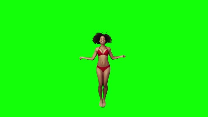 一个黑人女性跳绳慢动作，在绿色背景下
