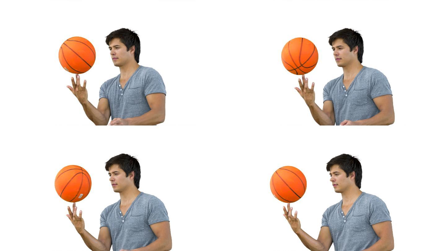 一个西方男子用手指转篮球慢动作，在白色背景下