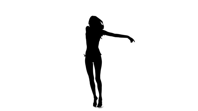 一个女人的剪影在白色的背景下慢动作跳舞