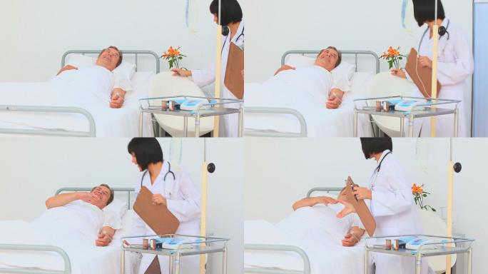 一位亚洲护士在医院探望病人