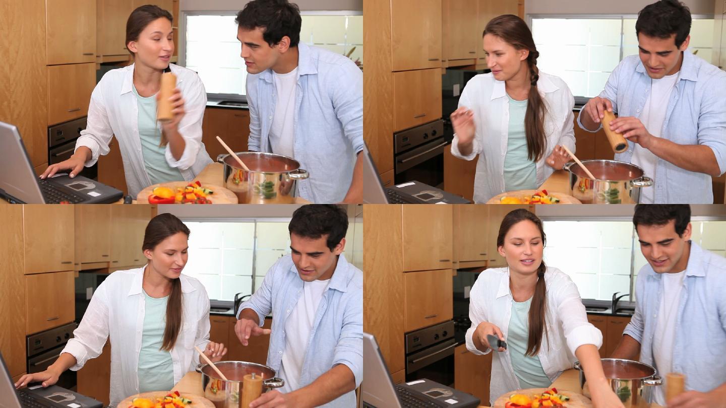 镜头升起，显示一对夫妇一起烹饪，他们把食物放入锅中