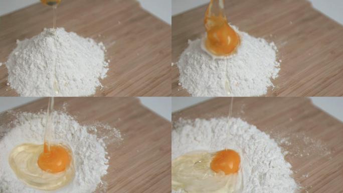 鸡蛋是超级慢镜头落到厨房桌上的面粉上
