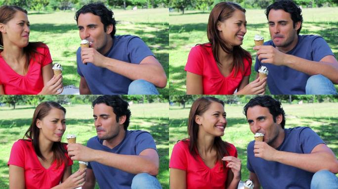快乐的夫妇在乡下吃冰淇淋
