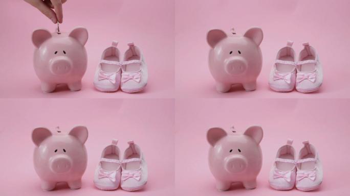 手扔硬币在粉红色的婴儿鞋的存钱罐里