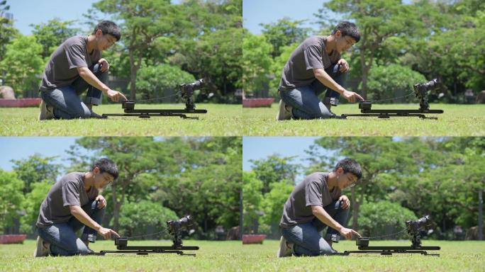 【4K正版】草坪上使用滑轨拍摄的摄影师