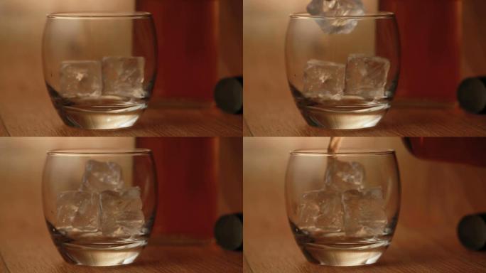 用钳子将冰块放入玻璃杯中，将威士忌倒在木头表面上