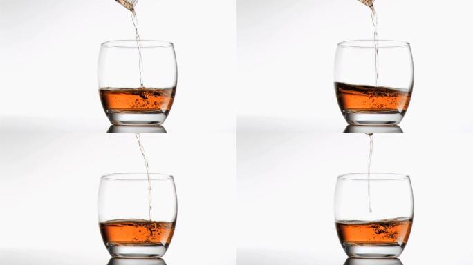 威士忌以超慢动作倒入玻璃杯中，背景为白色