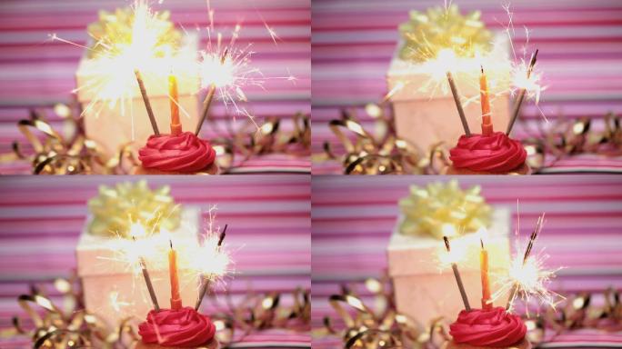 生日蛋糕上的烟花，粉红色的条纹背景上有丝带