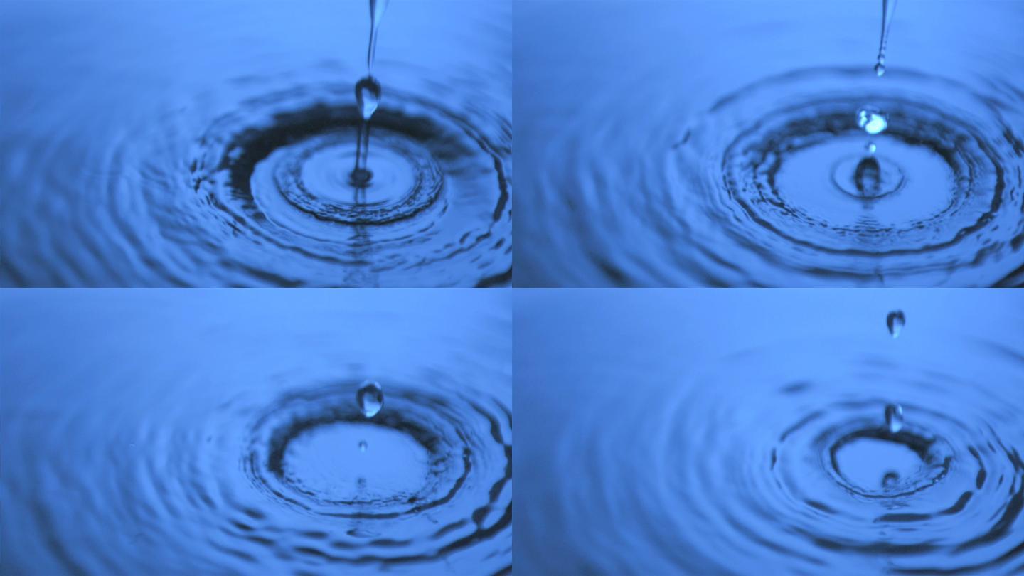 在蓝光下，水以超慢的动作滴在表面上