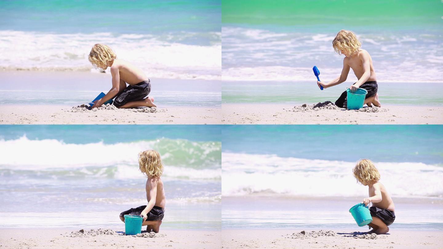 金发小孩在沙滩上玩铲子