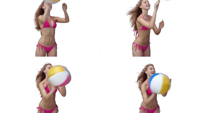 一个女人在白色的背景下快乐地玩沙滩球
