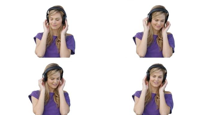 一个女人戴着耳机在白色背景下听音乐