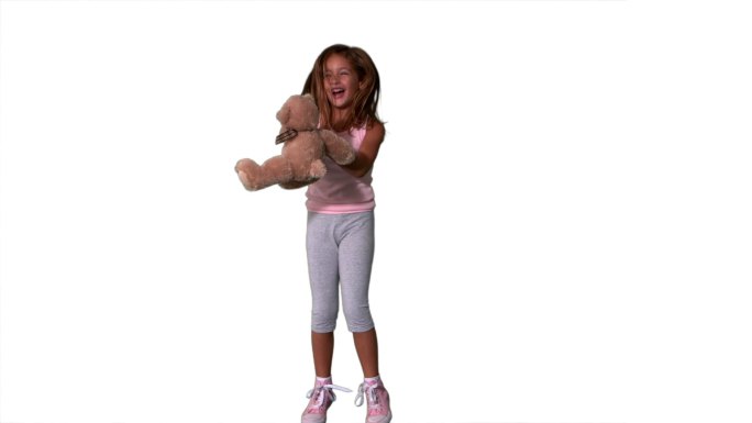 一个西方女孩捕捉泰迪熊慢镜头，在白色背景下
