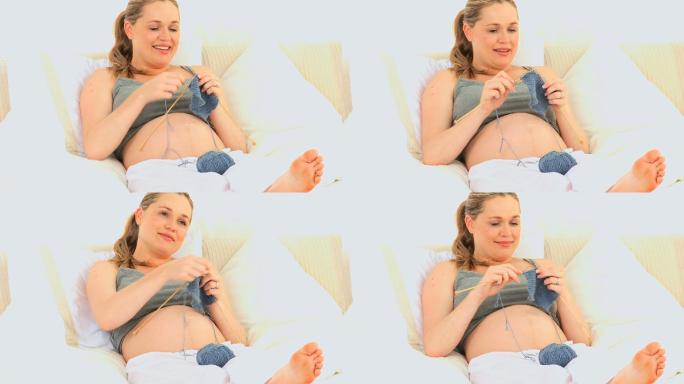 孕妇在床上编织孕妇孕妇活动放松心情孕妇心