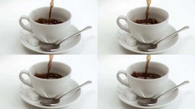 一杯咖啡在超级慢动作被填充在白色的背景