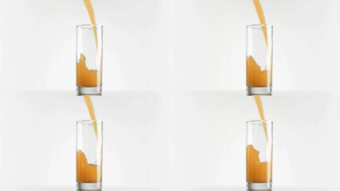 用超慢的动作将芒果汁倒入玻璃杯中