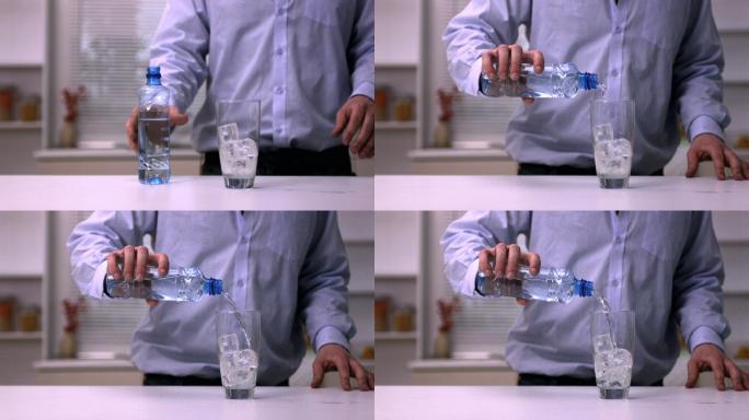 一名男子将水倒入玻璃杯中的慢动作