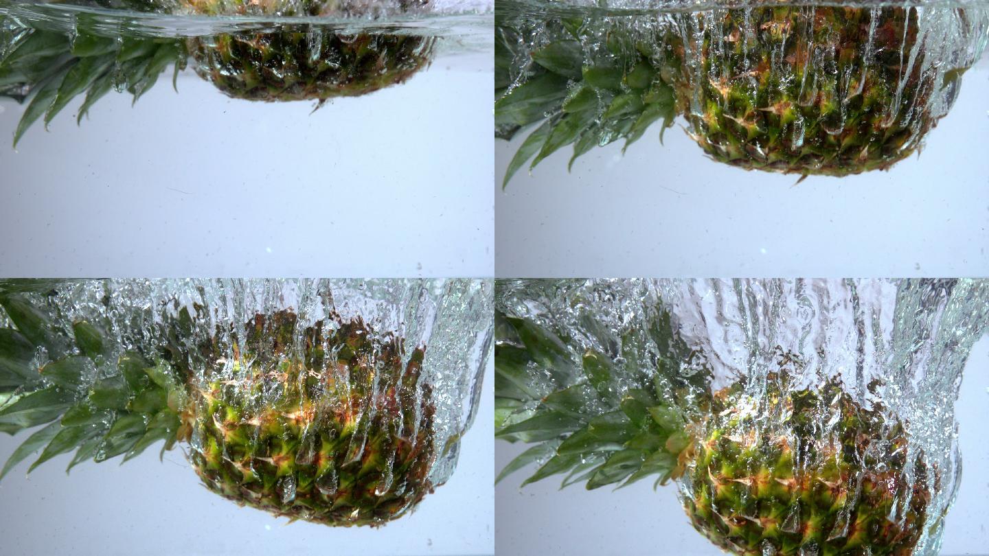 在慢动作的白色背景下，菠萝落在水中