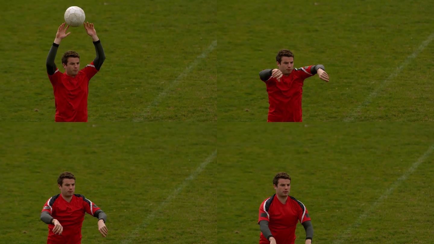 穿红色衣服的足球运动员在用慢动作扔球
