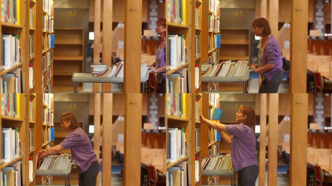 图书馆管理员推着手推车在图书馆还书