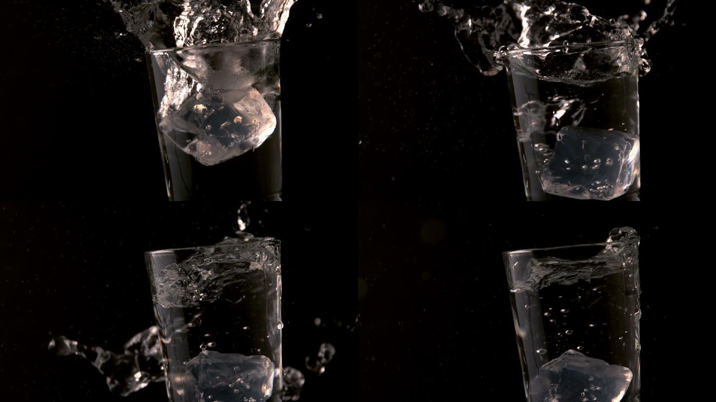 冰块在慢镜头中落入一杯水中