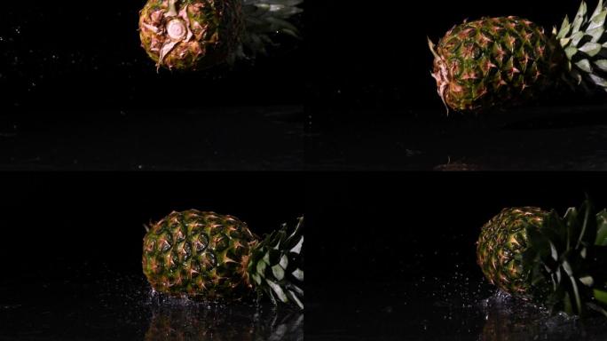 慢镜头中，菠萝旋转并落在潮湿的黑色表面上