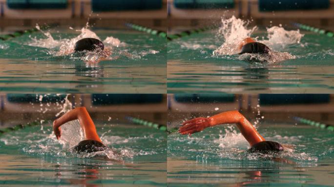 健康的女子游泳运动员在游泳池做缓慢的前泳