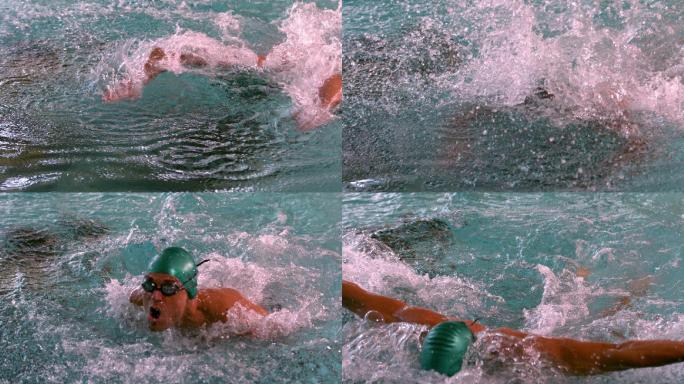 肌肉发达的游泳者在游泳池中做缓慢的蝶泳动作
