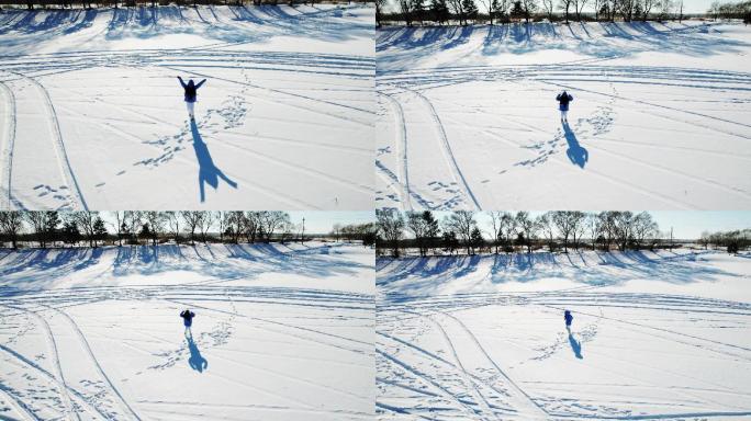 冬天雪地里跳跃的女孩