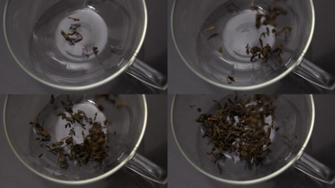 慢动作将散茶倒入玻璃杯中