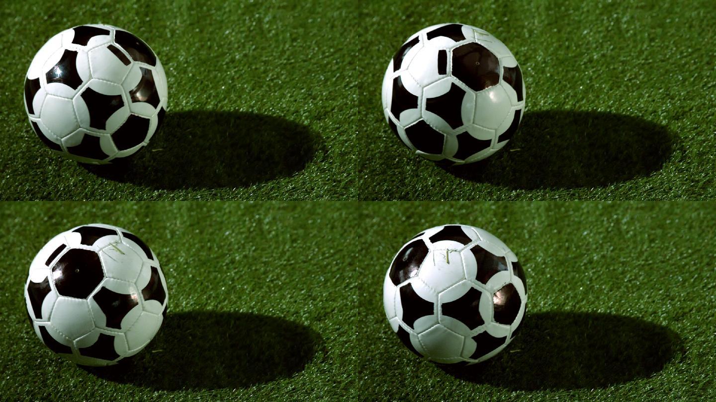 足球在草地上慢镜头旋转